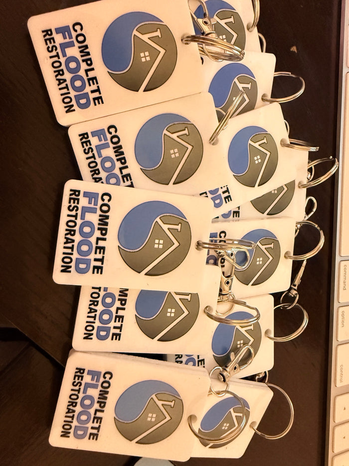 Bulk custom UV printed NFC keychains personalized with a full color business logo