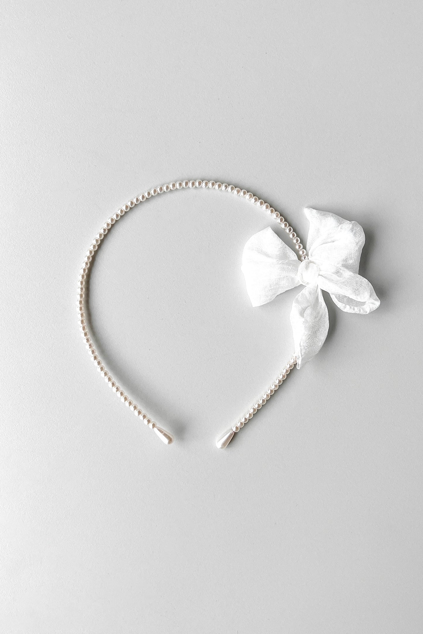 BEADED HEADBAND WITH BOW