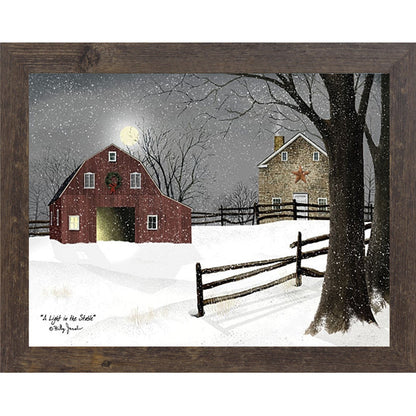 Natural brown framed landscape Billy Jacobs wall art print of a red barn with a Christmas wreath and glowing door on a moonlit snowy night with a stone farmhouse and split rail fence titled "A Light in the Stable"