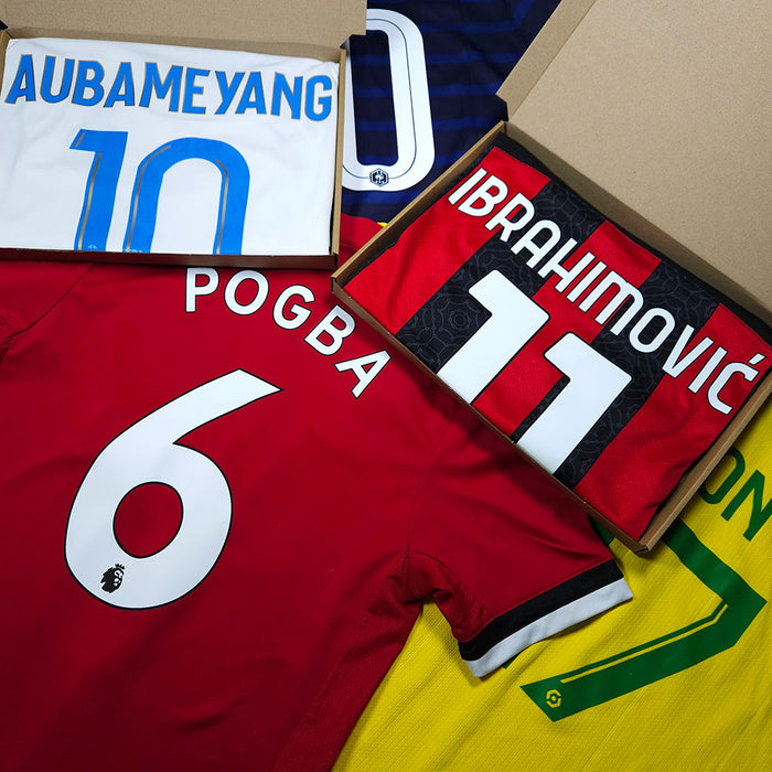 Mystery boxes with multiple football shirts with player names on the back of the shirt