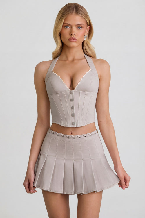 Low-Rise Pleated Mini Skirt in Ecru