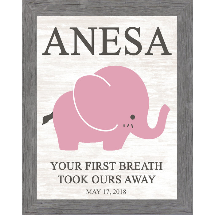 Gray framed personalized pink elephant nursery wall art with bold baby name at top and the words Your First Breath Took Ours Away with birth date on soft white shiplap background — PER149