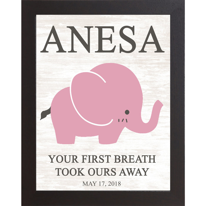 Black framed personalized pink elephant nursery wall art with bold baby name at top and the words Your First Breath Took Ours Away with birth date on soft white shiplap background — PER149